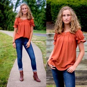 Beautiful ruffle sleeve top. Ruched detail. Elastic on arms.